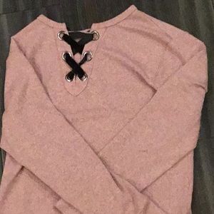 Pink sweatshirt with black string.